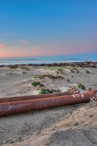 istock Dredge pipes lying on the beach ready for assembly. 508622788