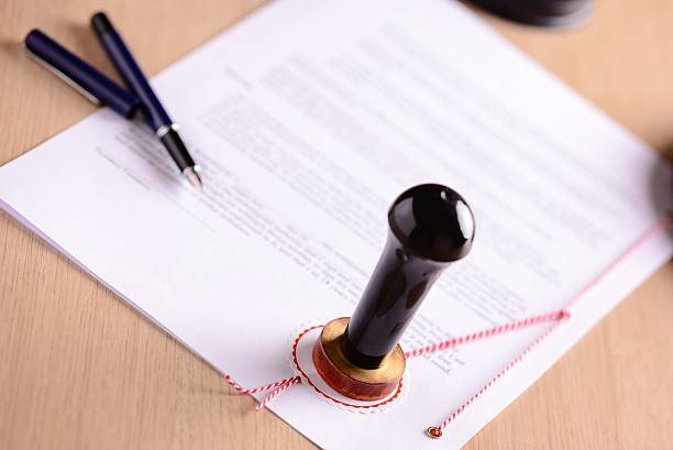 istock Notary's public pen and  stamp on testament 508624004