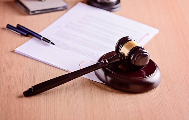 Gavel and judgement on desk.