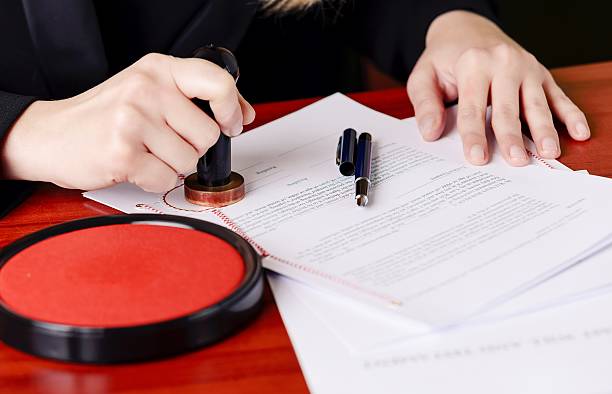 istock Close up on notaries  public hand stamping the testament 508624234
