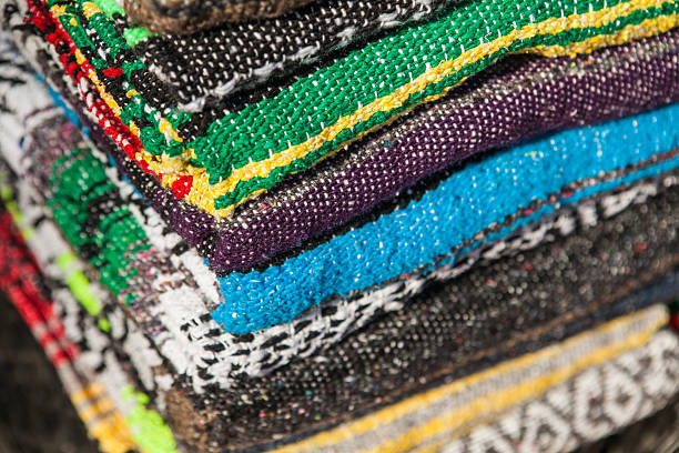 istock Colorful Mexican serapes hang in row. 508624264