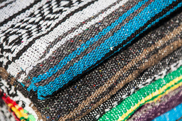 istock Colorful Mexican serapes hang in row. 508624282