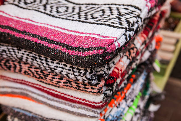 istock Colorful Mexican serapes hang in row. 508624606