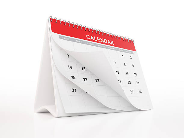 Red Monthly Desktop Calendar A 2016 monthly calendar with curled pages. The calendar is red in colour and standing on a white reflective background. Isolated on white. Clipping path is included. friday stock pictures, royalty-free photos & images