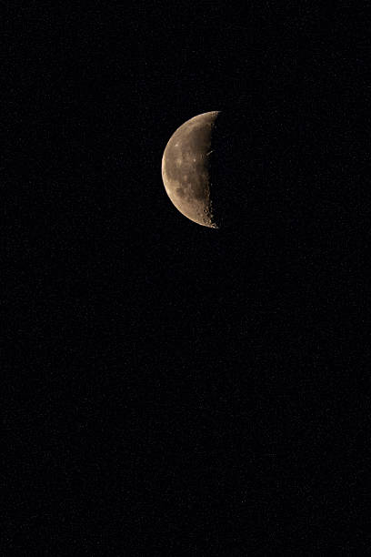 istock quarter of moon and stars 508625911