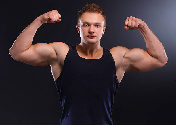 istock Healthy muscular young man. Isolated on black background 508626442
