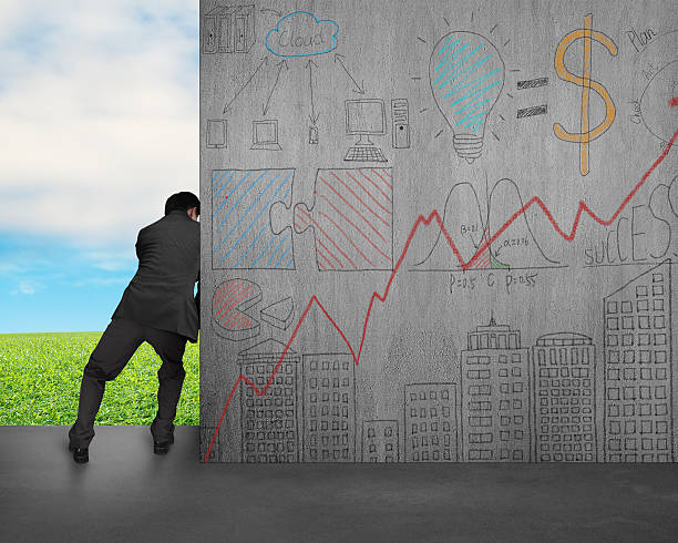 istock man push away concrete wall with doodles 508626737