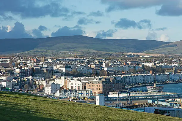 Douglas Isle of Man British Isles with the mountain where the famous motorbike TT road races occur and the Ferry Terminal