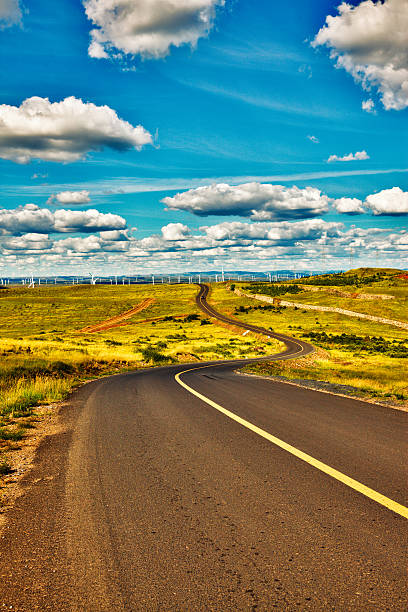 istock Power Generating Windmills and road 508628681