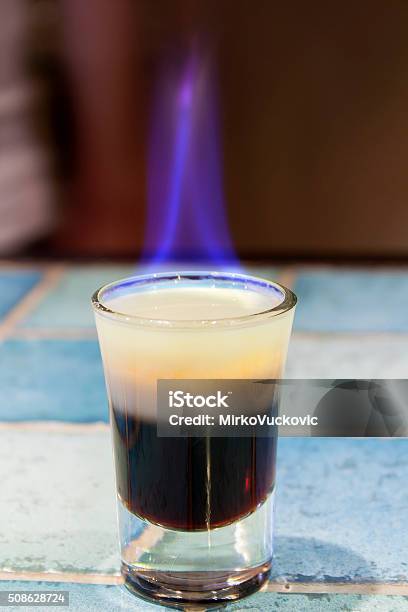 Cocktail B52 In Flames Stock Photo - Download Image Now - Coffee Liqueur, Alcohol - Drink, Bar - Drink Establishment