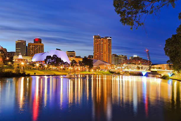 ADE river sunrise Capital of SOuth Australia - Adelaide city CBD at sunrise reflecting in still waters of torrens river adelaide stock pictures, royalty-free photos & images