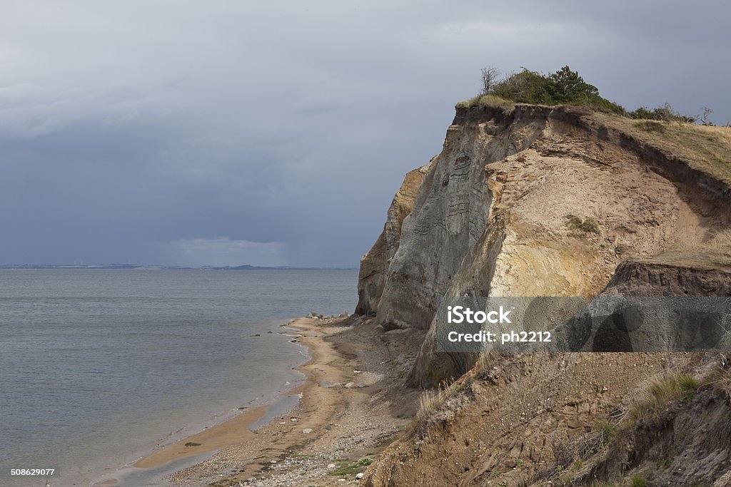 The Island Fur with Moler Cliff - Denmark Fur the most beautiful island of the inlet Limfjorden. A location with a lot of fossils hidden in moler also called diatomite. Cliff Stock Photo