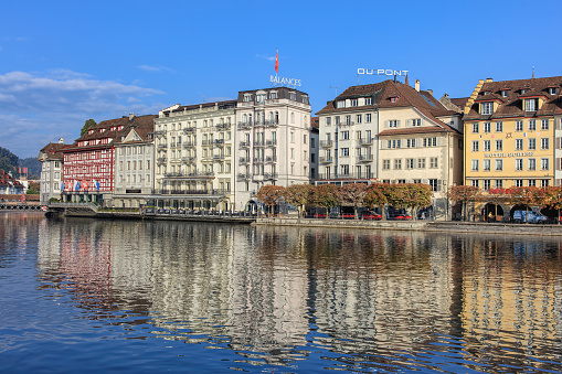 Lucerne, Switzerland - 3 October, 2015: the Reuss river and the St. Karliquai quay. Lucerne is a city in central Switzerland, it is the capital of the Swiss Canton of Lucerne and the capital of the district of the same name.