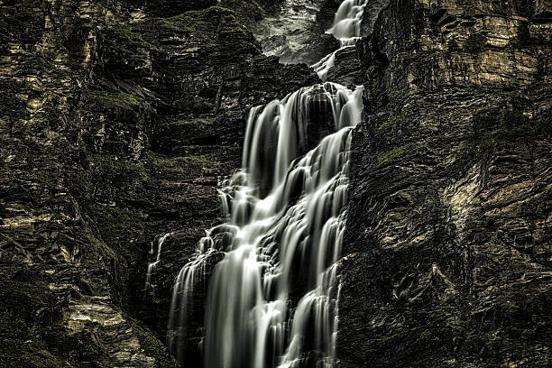 Dark water Waterfall North Norway stock photo