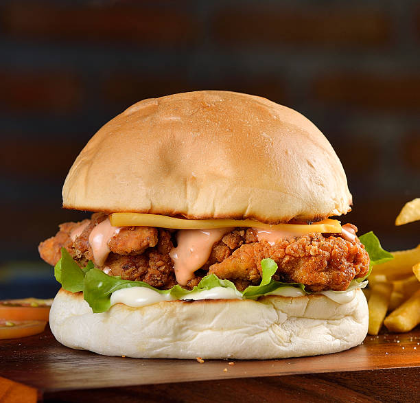 istock hamburger with chicken and cheese on a wooden 508630820