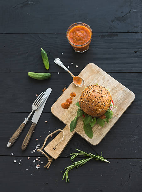 istock Fresh homemade burger on dark serving board with spicy tomato 508631332