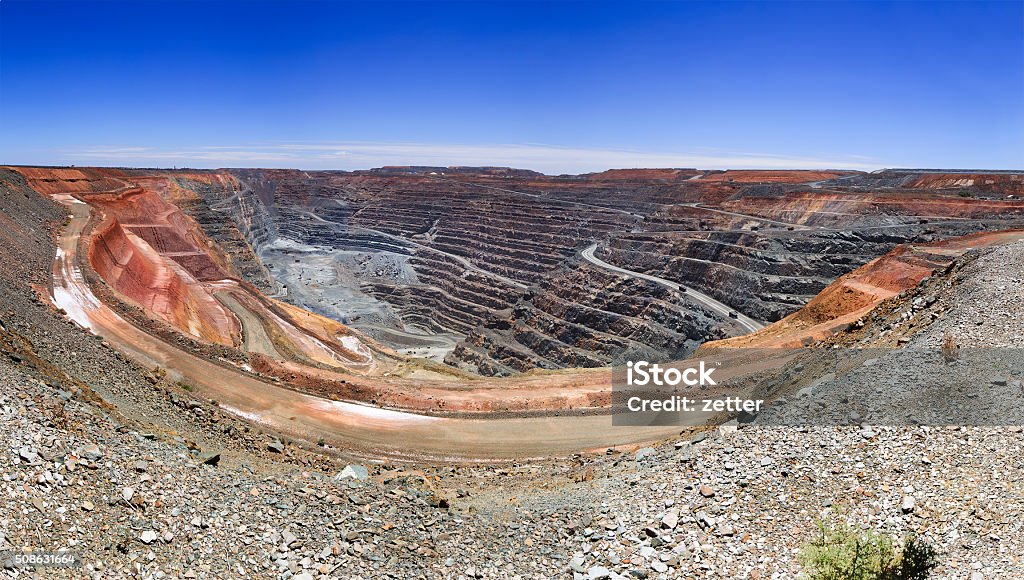 WA SUper Pit Panorama panorama of super fit gold mine in Kalgoorlie of Western australia with wide open pit underneath Mining - Natural Resources Stock Photo