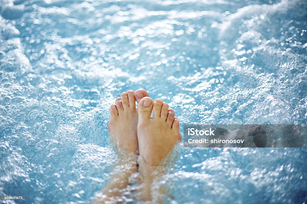 Hot tub Close-up of female legs in hot tub Hot Tub Stock Photo