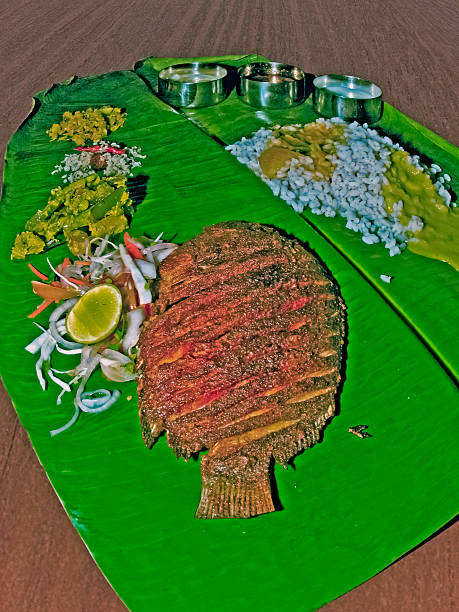 South Indian Thali (meals) with fish served traditionally on ban