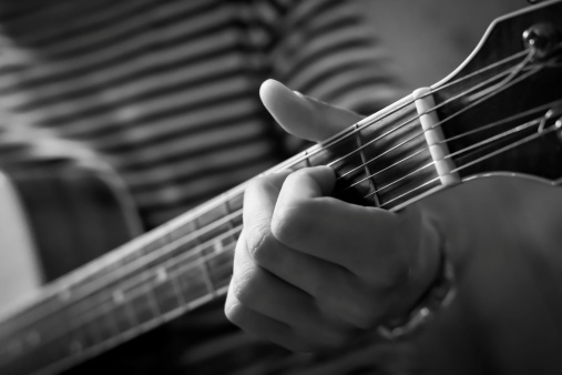 Close up of the guitarist's hand playing guitar