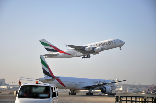 Dubai, United Arab Emirates - December 10, 2013: Emirates Airbus A380 take off at Dubai International Airport Terminal
