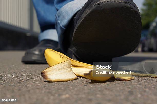 Slipping On A Banana Peel Stock Photo - Download Image Now - Banana Peel, Skidding, Men
