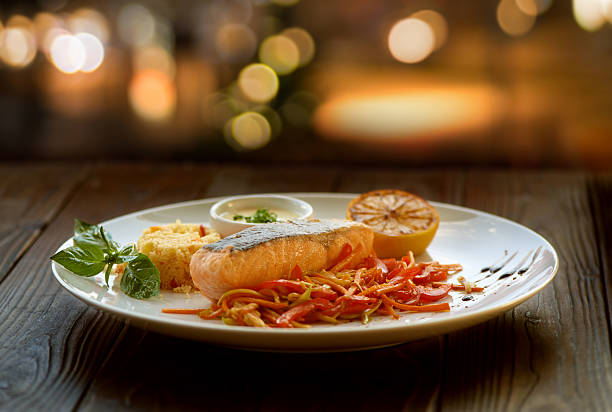istock salmon steak with couscous and vegetables 508633309