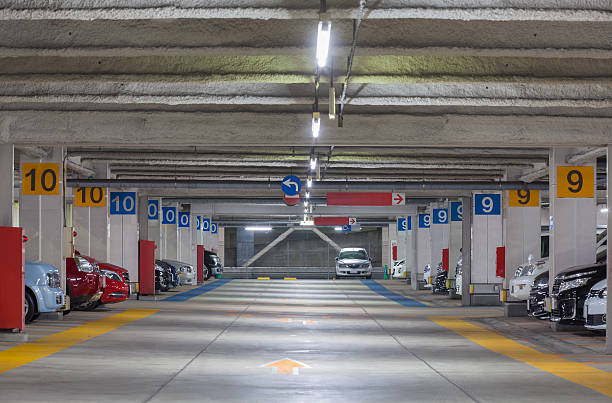 istock Parking garage underground interior, neon lights at night 508634948