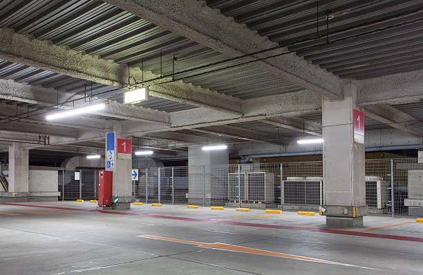 istock Parking garage underground interior, neon lights at night 508634992