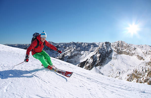 istock Skier skiing downhill in high mountains against sunset 508646543