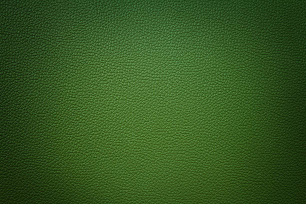 istock green color synthetic leather texture background with vignette 508647819