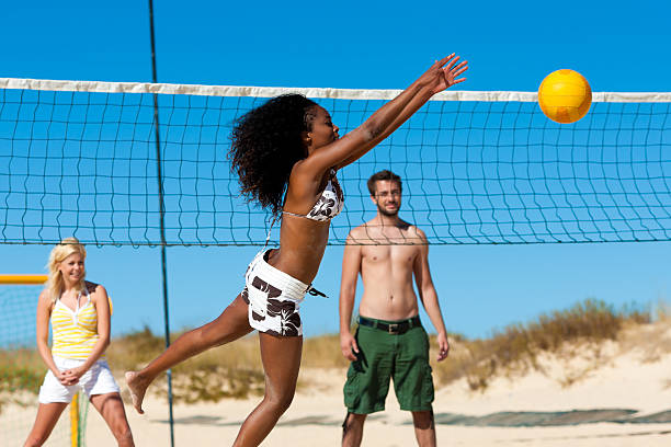 istock Friends playing beach volleyball 508648275