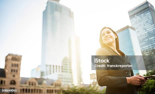 Business Woman With Arm Crossed On Urban Scene Stock Photo - Download Image Now - Intelligence, Businesswoman, Building Exterior