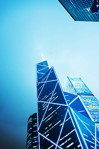 Business towers Hong kong business towers at night. the bank of china tower stock pictures, royalty-free photos & images