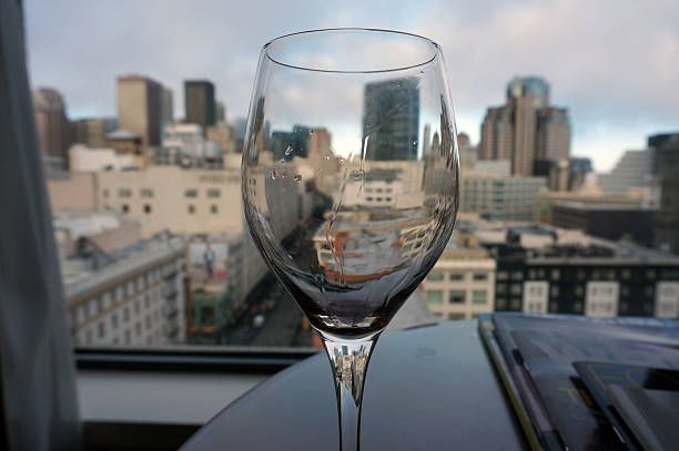 istock Empty glass in front of horizontal city view 508650041