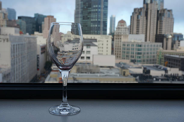 istock Empty glass on window in front of horizontal city view 508650045