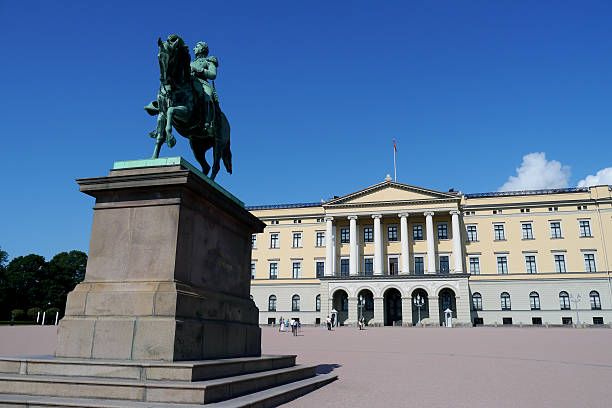 istock statue and palace in oslo, blue skies 508650781