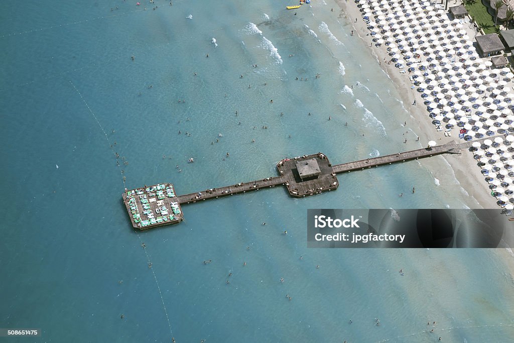 aerial view beach club pier aerial view of a beach club pier with unrecognisable people Beach Stock Photo