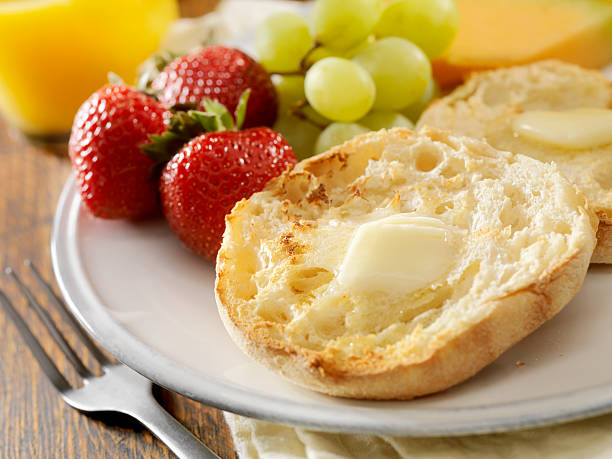 English Muffins English Muffins with Melted Butter -Photographed on Hasselblad H3D2-39mb Camera continental breakfast photos stock pictures, royalty-free photos & images