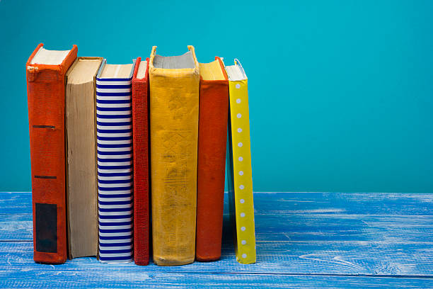 istock Stack of hardback books on wooden table. Back to school 508654326