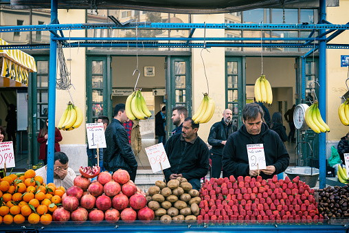 Athens, Greece - January 29, 2016: Fruit Seller at Monastiraki square - Urban Scene near the famous flea market.