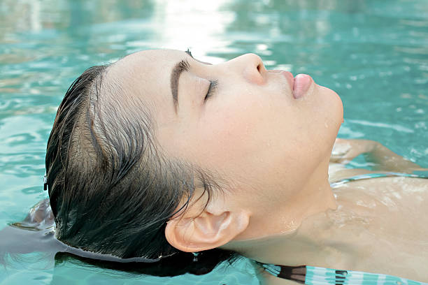 istock Young woman relaxing in the swimming pool 508659734