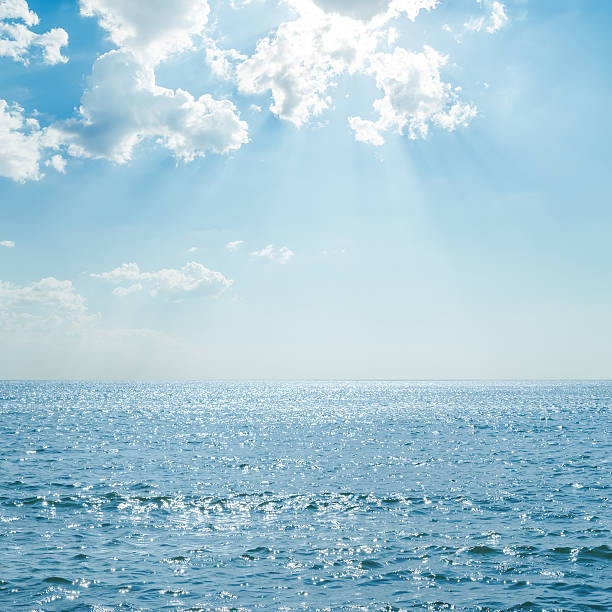 istock blue sea with reflections under clouds and sunshine 508662642
