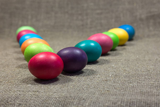 istock Easter colored eggs on dark green rough cotton texture concept 508662816