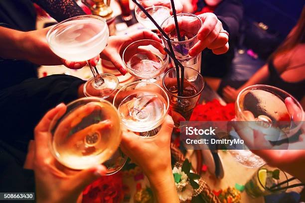 Clinking Glasses And Toasting Stock Photo - Download Image Now - Organized Group, Drink, Alcohol - Drink