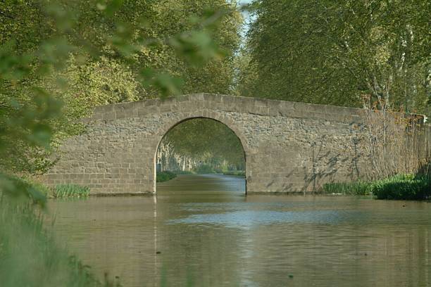 Stone bridge over canal stock photo