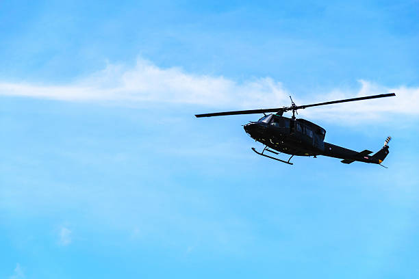 istock helicopter silhouette in the blue sky thailand 508666952