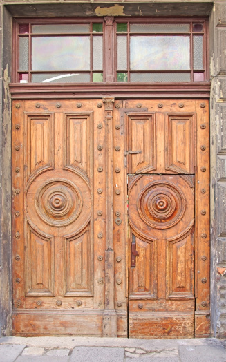 Heavy old gate door made of wood