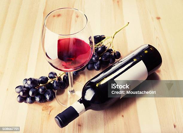 Red Wine Glass Bottle And Grapes On Wood Table Stock Photo - Download Image Now - Abstract, Alcohol - Drink, Art