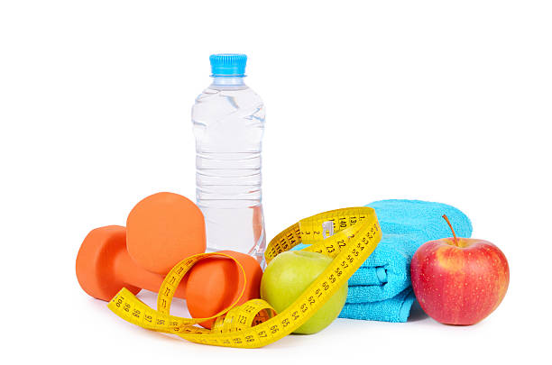 istock Measuring tape with dumbbells isolated 508668190